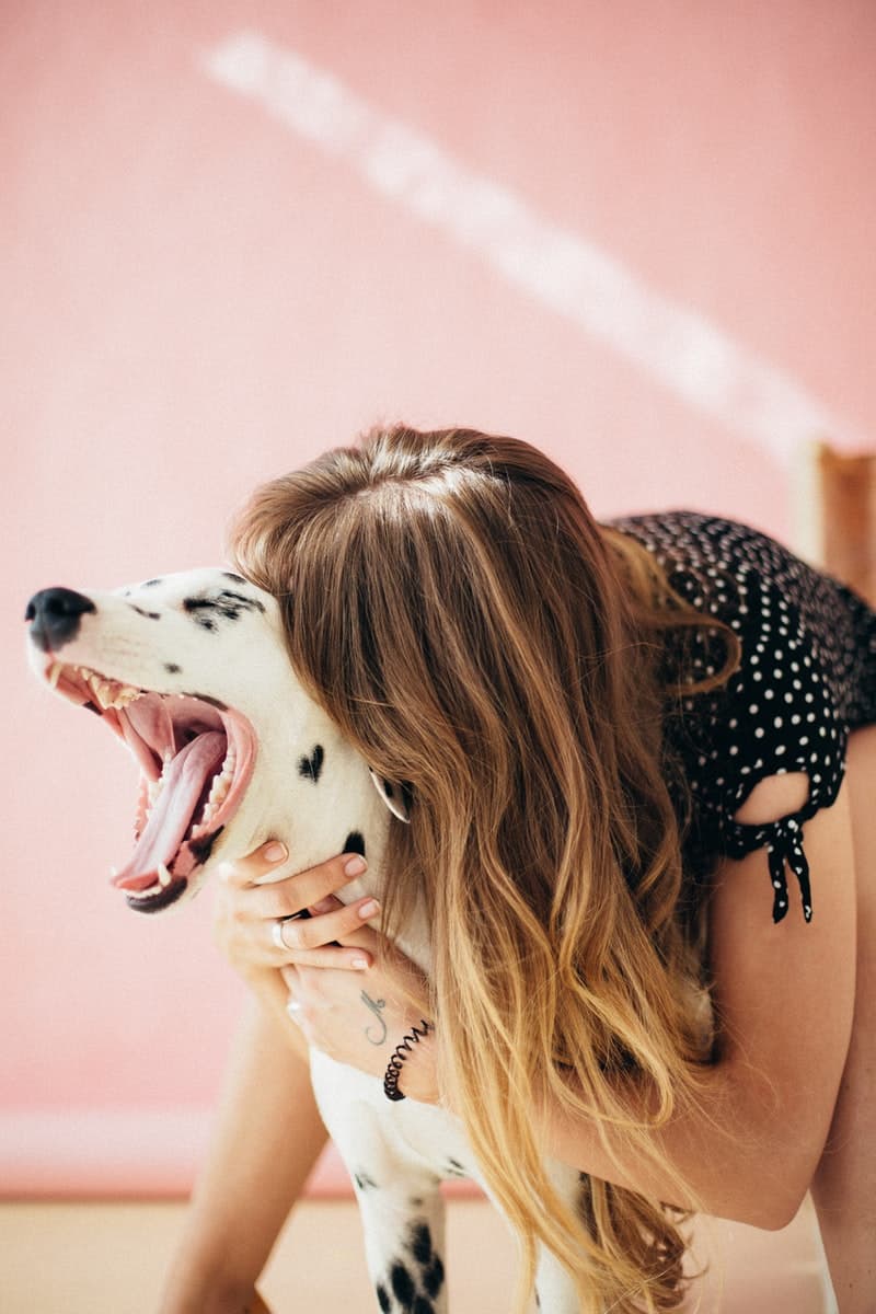 woman playing with her dog