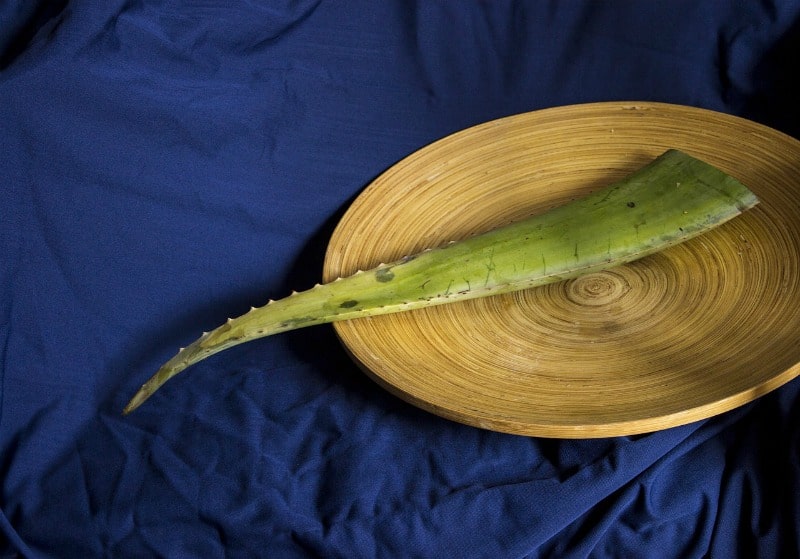 a piece of aloe on a wooden plate
