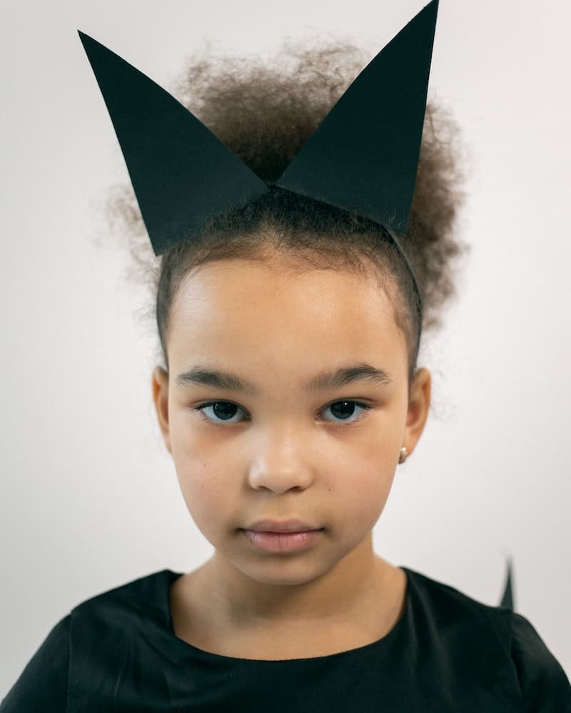 a girl wearing a cat ear headband