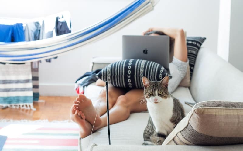 a woman relaxing with her cat