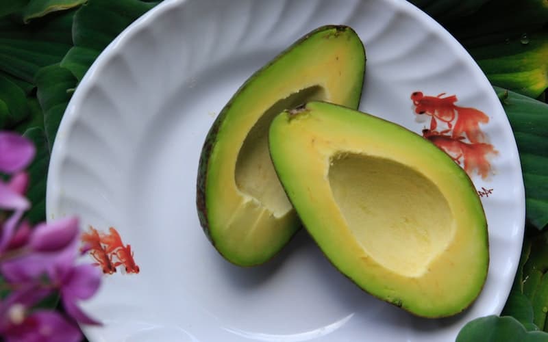 sliced avocado on a white plate